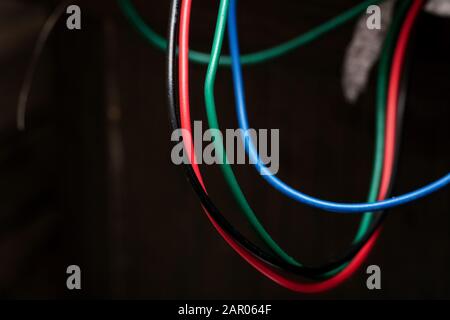 Multi colored wires on an electronic device Stock Photo