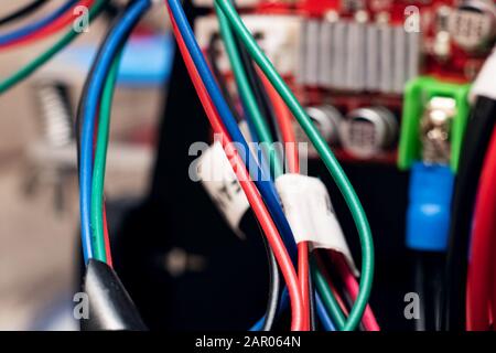 Multi colored wires on an electronic device Stock Photo