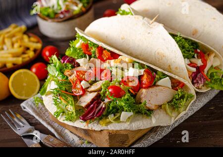 Fresch tortilla with grilled chicken, salad, eggs and cheese Stock Photo