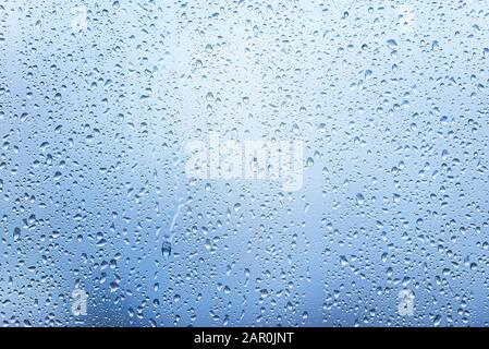 Window with Drops after heavy Rain, Water Drops on Glass as Background or Texture Stock Photo