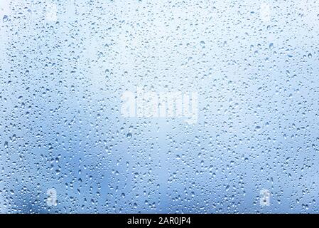 Window with Drops after heavy Rain, Water Drops on Glass as Background or Texture Stock Photo