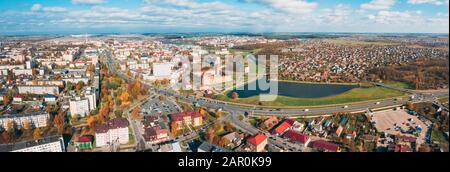Lida, Belarus. Aerial Bird's-eye View Of Cityscape Skyline. Lida Castle In Sunny Autumn Day. Famous Popular Historic Landmark. Panorama, Stock Photo