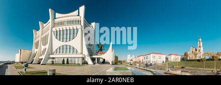 Grodno, Belarus - October 16, 2019: Grodno Regional Drama Theater And Catholic Church Of Discovery Of Holy Cross And Bernardine Monastery In Sunny Aut Stock Photo