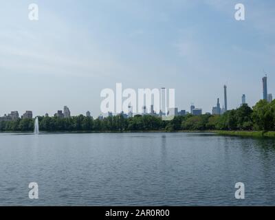 New York, USA - June 2, 2019: Image of the Jacqueline Kennedy Onassis Reservoir in Central Park. The image also gives a good view on billionaires' row Stock Photo