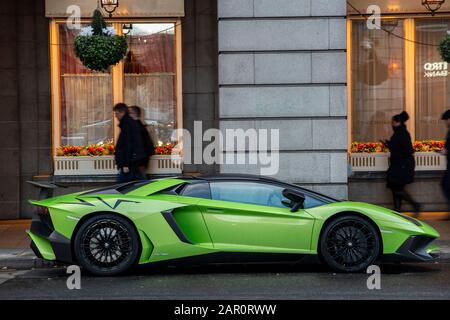 An illegally parked Lamborghini super car outside the famous Ritz Hotel on London's Piccadilly Stock Photo