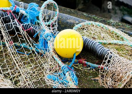Premium Photo  Blue fishing net on a pontoon with its ropes and floats  covered with morning frost