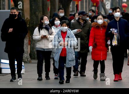 Beijing, China. 25th Jan, 2020. Chinese wear protective respiratory masks in Beijing on Saturday, January 25, 2020. All major Chinese New Year events have been cancelled in China's capital, along with all other large-scale activities in a bid to prevent the spread of the coronavirus. China virus death toll has hit 41. Photo by Stephen Shaver/UPI Credit: UPI/Alamy Live News Stock Photo