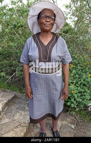 Woman in traditional dress made of shweshwe fabric, Mpumalanga, South Africa. Stock Photo