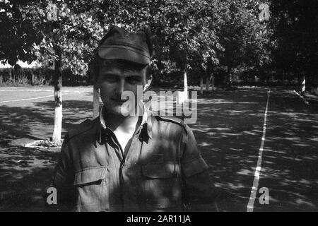 STUPINO, MOSCOW REGION, RUSSIA - CIRCA 1992: Portrait of a soldier of the Russian army. Black and white. Film scan. Large grain. Stock Photo