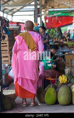 Nun shopping at Thiri Mingalar Vegetable and Fruit wholesale market at Yangon, Myanmar (Burma), Asia in February - market stall holders vendors Stock Photo