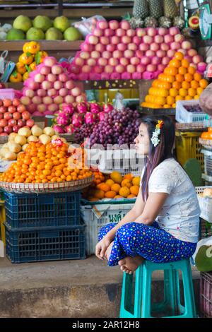 Fruit vendor at Thiri Mingalar Vegetable and Fruit whole sale market at Yangon, Myanmar (Burma), Asia in February Stock Photo