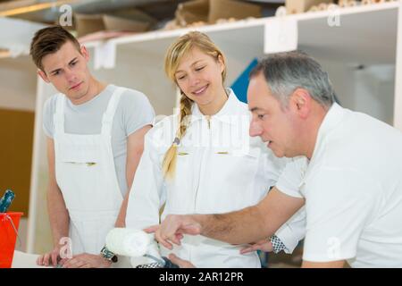 portrait of apprentices learning to paint Stock Photo