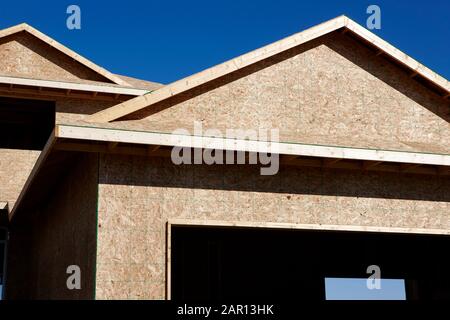 timber framed house under construction in canada Stock Photo