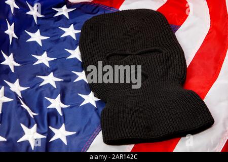 black balaclava ski mask lying on united states of america flag Stock Photo