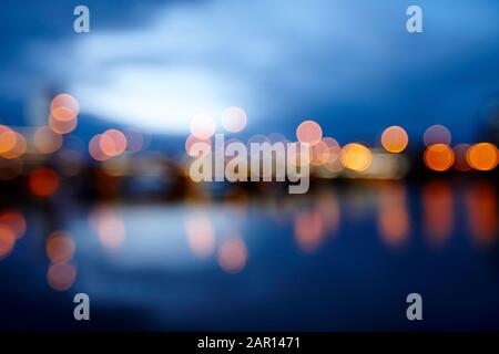 abstract out of focus photograph of queens bridge and river lagan Belfast waterfront at night Northern Ireland UK possible use blurred vision eyesight Stock Photo