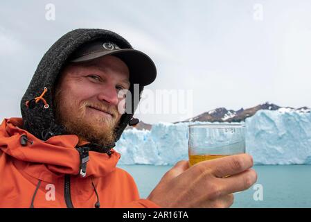 Drinking Whiskey with glacier ice at The Perito Moreno Glacier, El Calafate, Argentina Stock Photo