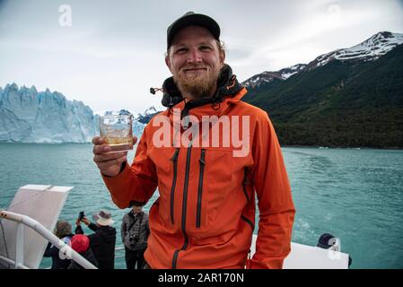 Drinking Whiskey with glacier ice at The Perito Moreno Glacier, El Calafate, Argentina Stock Photo