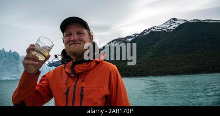 Drinking Whiskey with glacier ice at The Perito Moreno Glacier, El Calafate, Argentina Stock Photo