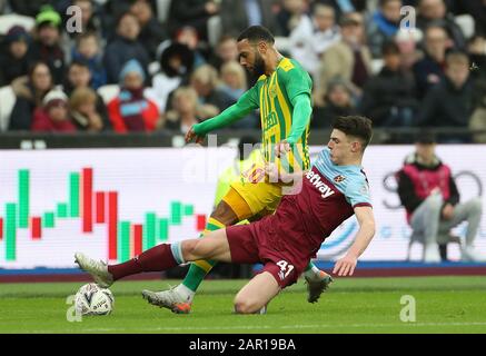 West Bromwich Albion's Matt Phillips (left) and West Ham United's Declan Rice battle for the ball during the FA Cup fourth round match at the London Stadium. Stock Photo
