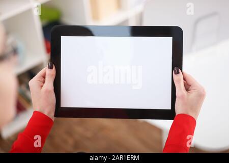 Woman holding tablet in hands Stock Photo