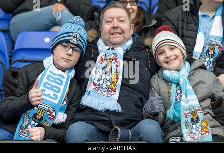 25th January 2020; St Andrews Stadium, Coventry, West Midlands, England; English FA Cup Football, Coventry City v Birmingham City; Coventry City supporters in the stands wearing team scarfs - Strictly Editorial Use Only. No use with unauthorized audio, video, data, fixture lists, club/league logos or 'live' services. Online in-match use limited to 120 images, no video emulation. No use in betting, games or single club/league/player publications Stock Photo