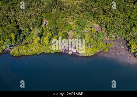 Lonely settlement at the ocean. Aerial view of Bougainville, Papua New Guinea