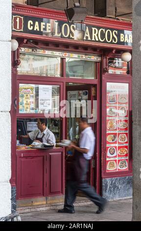 Waiters at a busy Cafe and tapas bar in the corner of the Plaza Mayor, Madrid, Spain. Stock Photo
