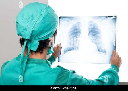 Surgeon analyzing a lung radiography Stock Photo