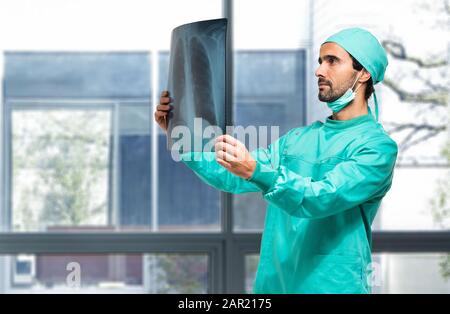 Surgeon analyzing a lung radiography Stock Photo