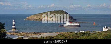 Hebridean Princess passing through the narrow channel between the island of Anglesey and Puffin Island at Penmon Point, North Wales Stock Photo