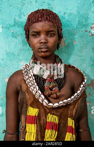 Konso, Ethiopia - August 7, 2018: Unidentified young Hamer tribal woman posing on the market Stock Photo