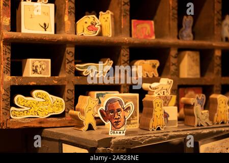 Artsy wooden blocks for sale including one of with a caricature. Barack Obama. Inside Fish's Eddy, a tchotchke store on Broadway in Manhattan Stock Photo