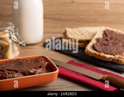 Vegan chocolate spread made of organic almond butter and organic cacao and honey Stock Photo