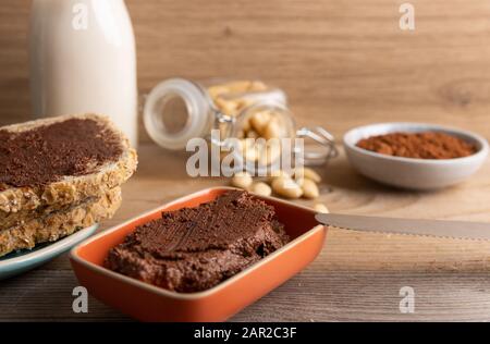 Vegan chocolate spread made of organic almond butter and organic cacao and honey Stock Photo