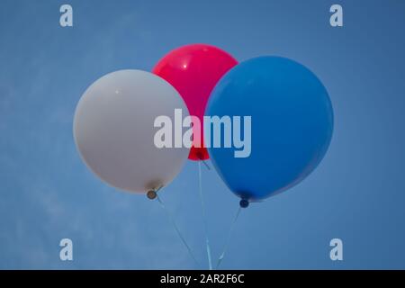 Blue, red, white balloon sky background . Blue,red, white balloon isolated on a blue background Stock Photo