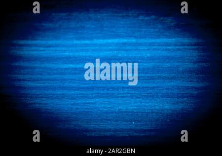 A bright blue oval in a black vignette. Stock Photo