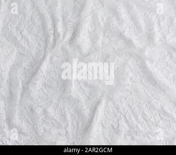 texture of crumpled white synthetic fabric guipure for sewing clothes on a  white background, full frame Stock Photo - Alamy