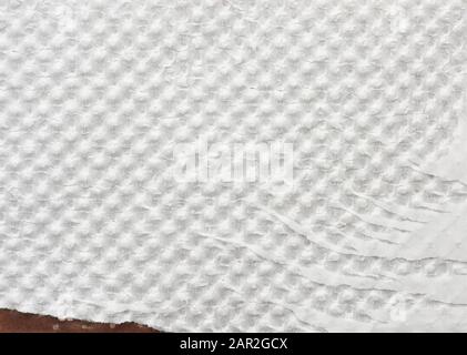 fragment of white tattered wrapping paper, full frame, close up Stock Photo