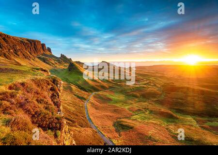 Magical Autumnal sunrise over the Quiraing rock formations caused by an ancient landslip on the Isle of Skye in Scotland
