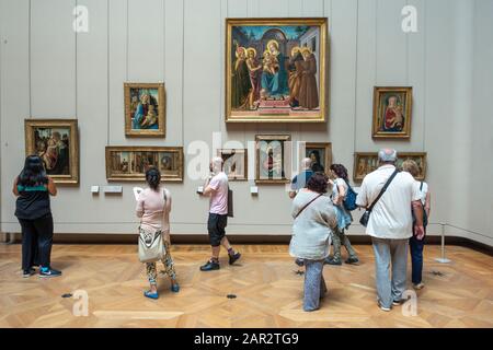 Visitors viewing European paintings in Denon Wing of Louvre Museum (Musée du Louvre) in Paris, France Stock Photo