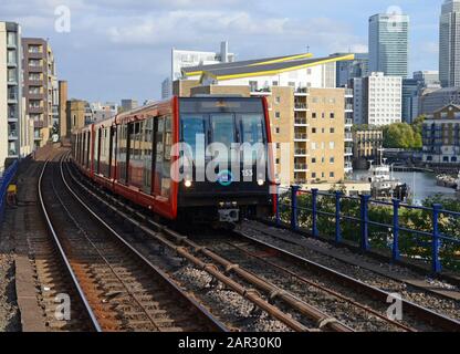 A Docklands Light Railway train enters Limehouse station in east London, UK Stock Photo