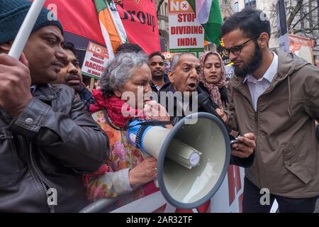 London, UK. 25th January 2020. A man leads the protesters in reciting the preamble to the Constitution of India which came into effect on Republic Day, 26 January 1970 and calls for justice, liberty, equality and fraternity at the end of the protest against the Citizenship (Amendment) Act of the Hindu fascist Modi regime which has prompted horrific state and far-right violence with Muslim neighbourhoods and homes have been invaded by the police and fascist mobs, young men murdered, women, children and elderly people beaten up and tortured and property destroyed. Peter Marshall/Alamy Live News