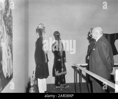 Opening of an exhibition on the Wah, an agricultural community in Pakistan, at the Royal Institute for the Tropics by Alderman Carriage in Amsterdam  Alderman Carriage in the company of a number of men while viewing one of the setups Date: 25 November 1965 Location: Amsterdam, Noord-Holland Keywords: population groups, traditional costumes, exhibitions Person name: Carriage, P.J. Stock Photo