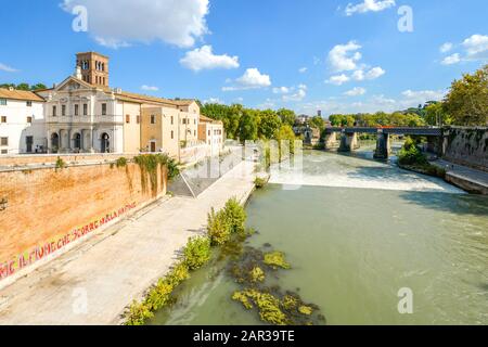 The Basilica of St. Bartholomew on Tiber Island alongside the Tiber River in the city of Rome Italy. Stock Photo