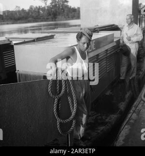 [Patrol boat on a river. Dutch military with a bunch] Annotation: The name of the ship: Irene? Date: 1947/01/01 Location: Indonesia, Dutch East Indies Stock Photo