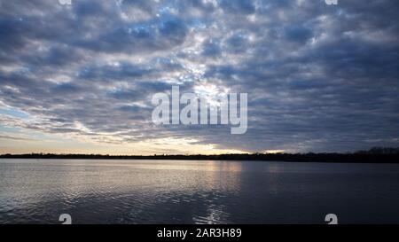 Fast moving clouds during sunset on White rock Lake. Stock Photo