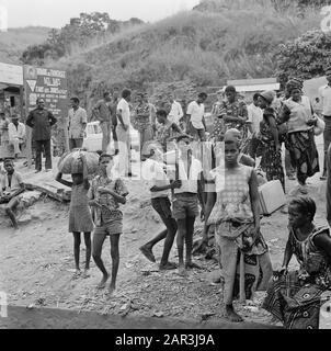 Zaire (formerly Belgian Congo)  Group of people in the countryside; children posing in the foreground Date: 24 October 1973 Location: Congo, Zaire Keywords: group portraits, children Stock Photo