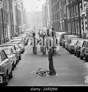 Carless Sunday in connection with the oil boycott  On horseback by the Jordaan Date: 4 november 1973 Location: Amsterdam, Noord-Holland Keywords: car-free Sundays, oil boycott, oil crisis, horses, riders Stock Photo