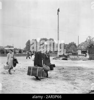 Repatriation Camp Rheine (Germany)  [Repatriants with luggage] Date: 1945 Location: Germany, Rheine Keywords: repatriation, World War II Stock Photo
