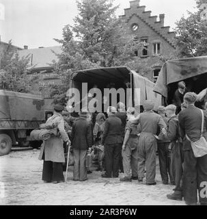 Repatriation Camp Rheine (Germany)  [Repatriants with trucks ready] Date: 1945 Location: Germany, Rheine Keywords: repatriation, World War II Stock Photo